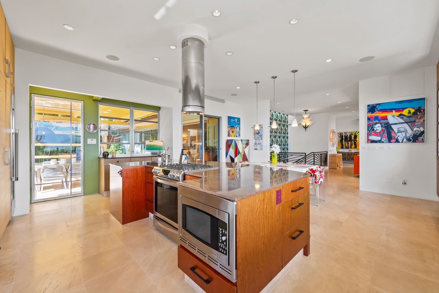 Open kitchen layout with dual ovens, sleek cabinetry, and generous prep space.