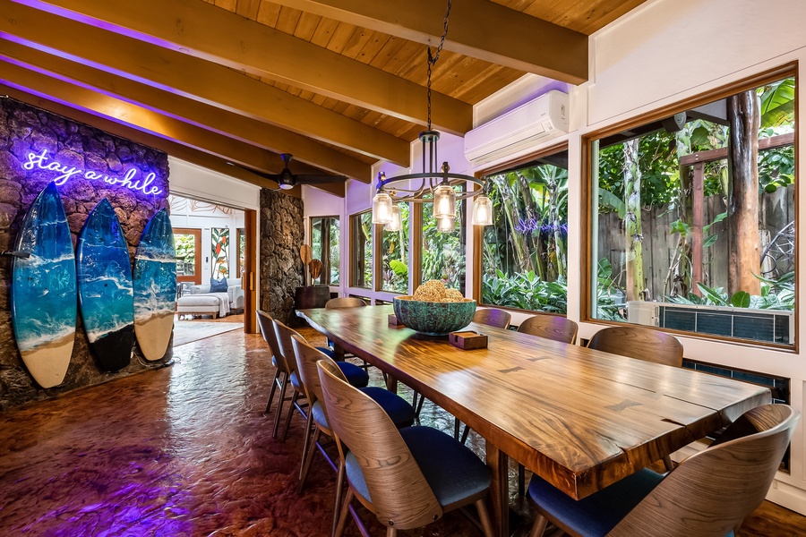 Naturally-lit formal dining area has gorgeous garden views.
