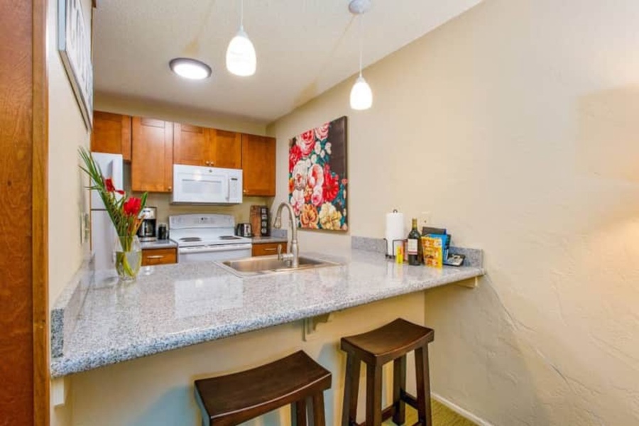 Kitchen area is open to the living area and has ample counter space for creating delicious meals
