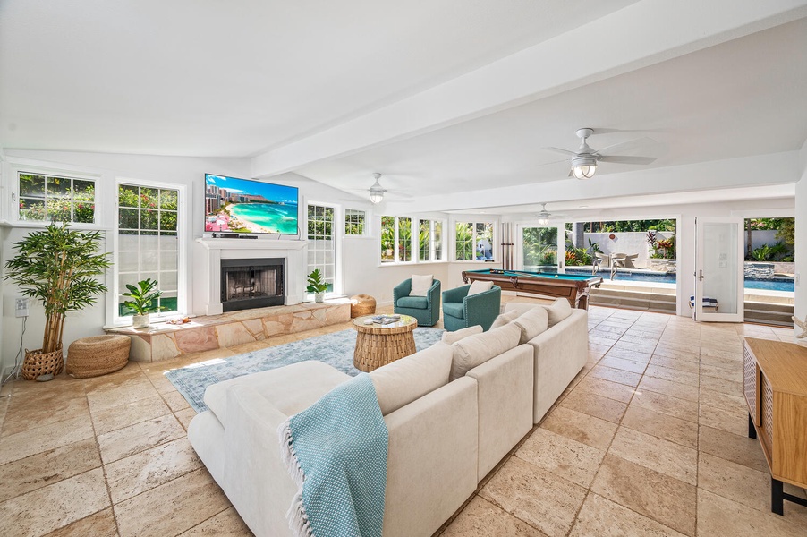 Enjoy the islands cross breeze in the main living-room, complete with pool table and a front porch to watch the basketball players in the group!
