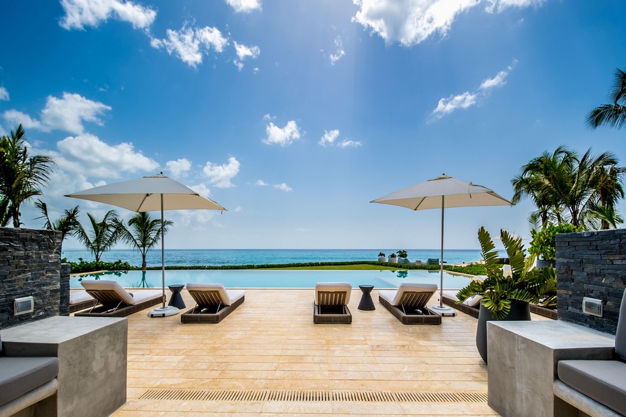 Soak up the sun on the poolside loungers with the serene backdrop of the ocean.