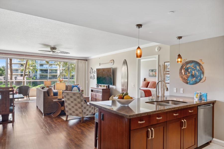 Indoor-outdoor living shines at Honua Kai Konea 204, where the living room opens directly to the shaded lanai.