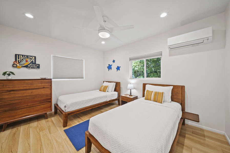 Twin bedroom designed with families in mind, complete with A/C and cheerful coastal décor for younger guests.