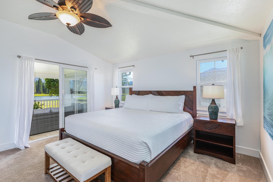 Primary bedroom with a king-size bed and calming decor.