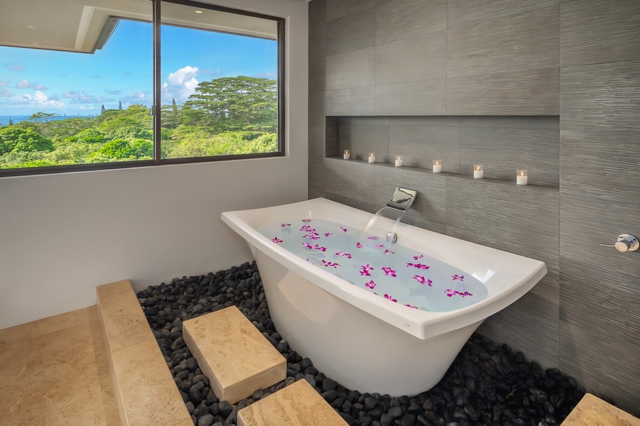 Relax in this luxurious soaking tub with a view, designed to provide a spa-like atmosphere.