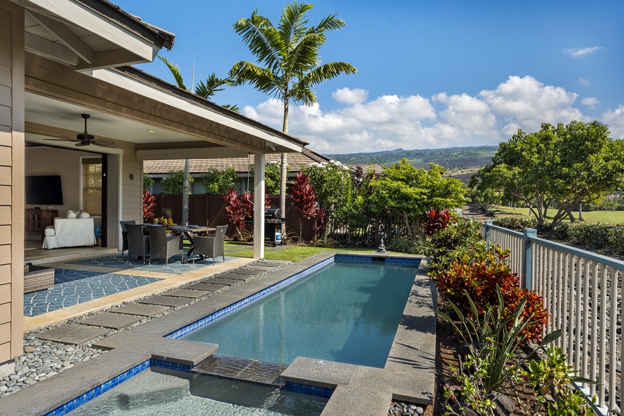 Take a dip in your private pool at Kona Blue Vacations Holua Kai, bordered by tropical palms and warm island sun.