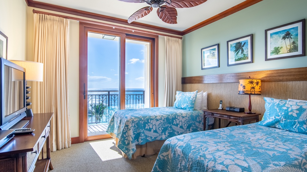 The second guest bedroom has an ocean view and access to the lanai.