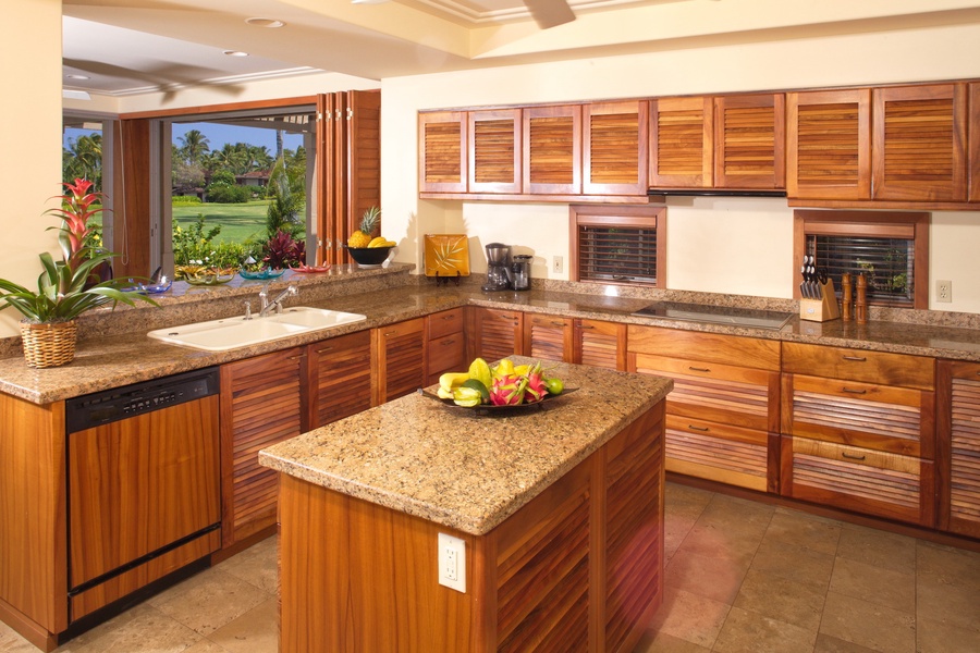 Elegant gourmet modern kitchen w/granite countertops and top tier appliances.