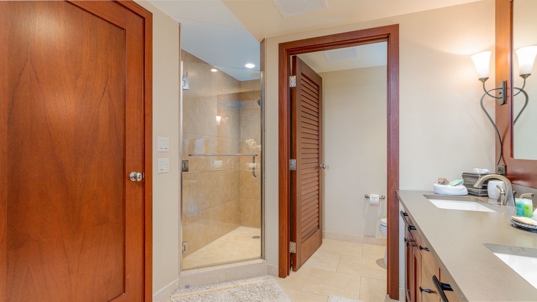Glass-enclosed walk-in shower completes your spa-inspired sanctuary.