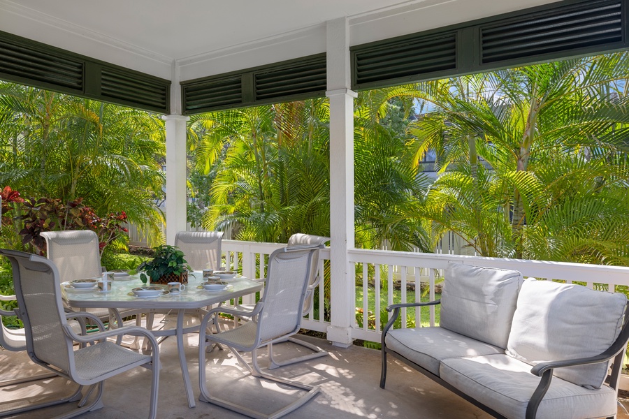 Enjoy peaceful outdoor dining surrounded by lush tropical greenery on your private lanai.