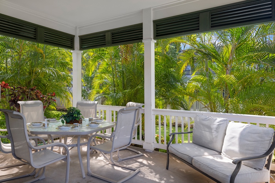 Peaceful outdoor dining area surrounded by lush greenery.