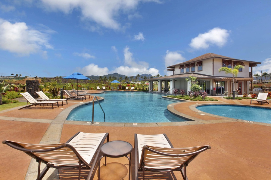 Resort-style pool area with lounge chairs and stunning mountain views—ideal for soaking up the sun.