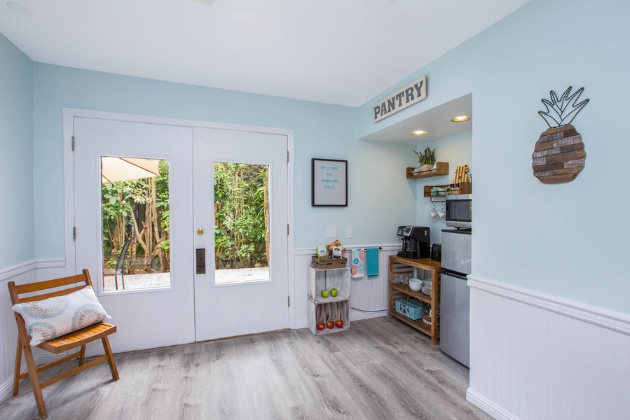 A bright and cozy sitting area bathed in natural light, perfect for enjoying a cup of coffee.