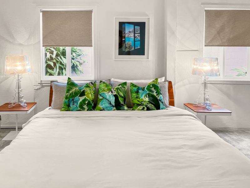 Spacious primary suite with a king bed and charming decor.