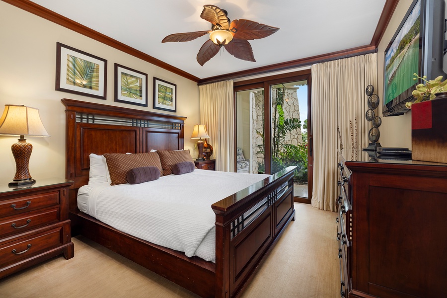 The primary guest bedroom with direct access to the resort gardens.