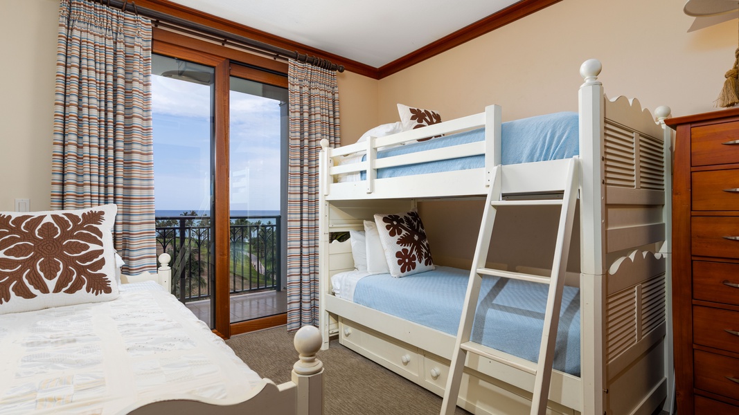 The third guest bedroom has twin single bed/twin bunk beds and private lanai access with ocean views.