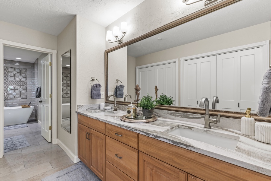 Full bathroom offers a spa-like experience with its luxurious amenities and serene ambiance