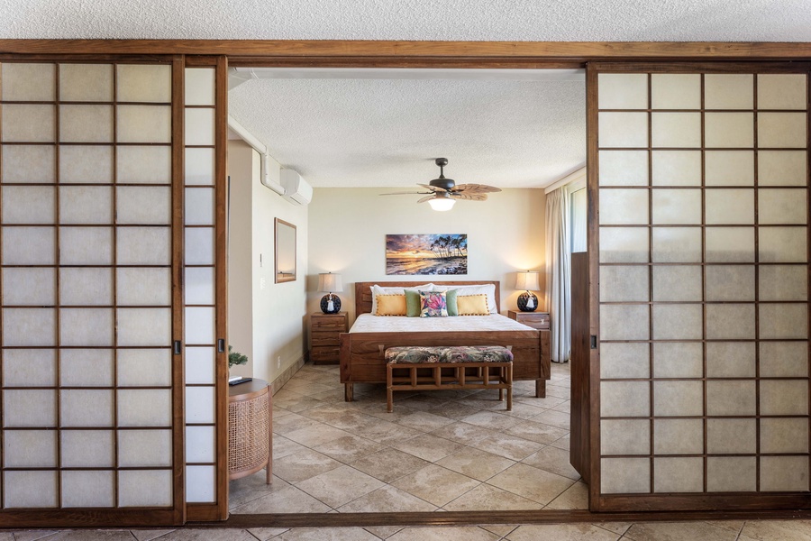 Welcome to the primary suite, where a cozy ambiance invites you to unwind in comfort and style.