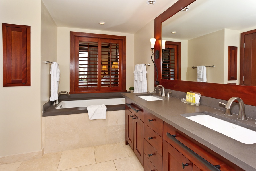 The primary bath has a walk -in shower and soaking tub.