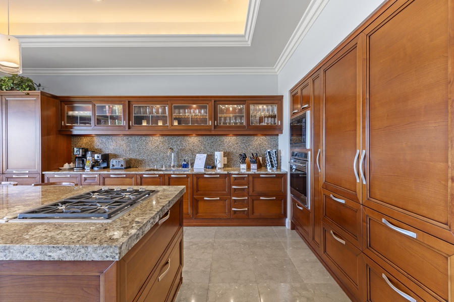 Cook with ease and style in Wailea Luxury Residence Hoolei 23-3’s elegant, fully equipped kitchen.