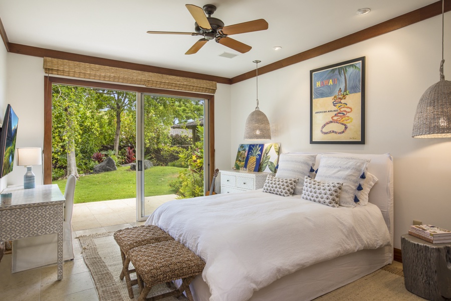 Second bedroom with a queen bed, wall-mounted television, private lanai & en suite bath