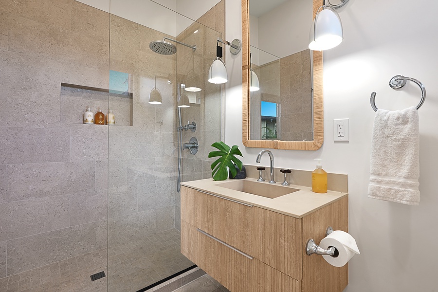 Modern fourth guest bathroom oasis with a separate walk-in shower and fresh, tropical touches.