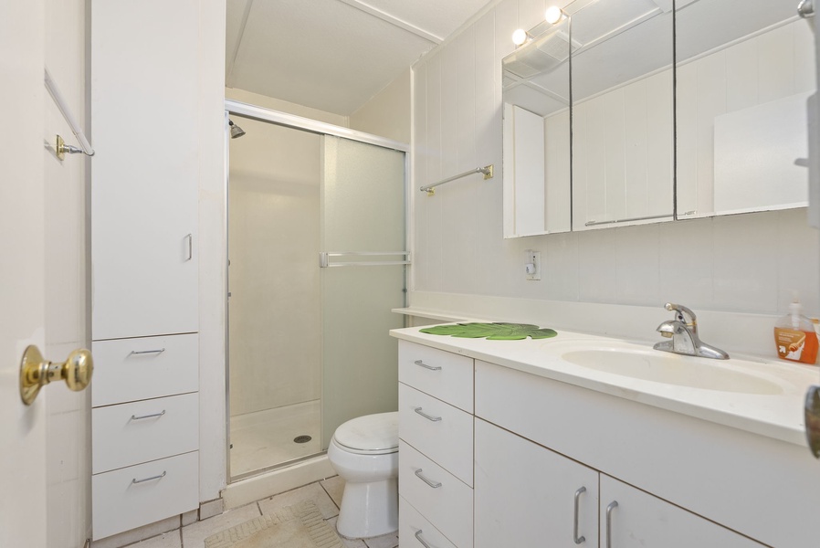 Full bathroom with modern fixtures and walk-in shower for easy access.