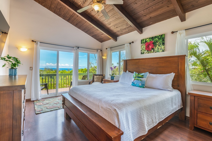 The Primary Bedroom has direct access to the deck with stunning ocean views