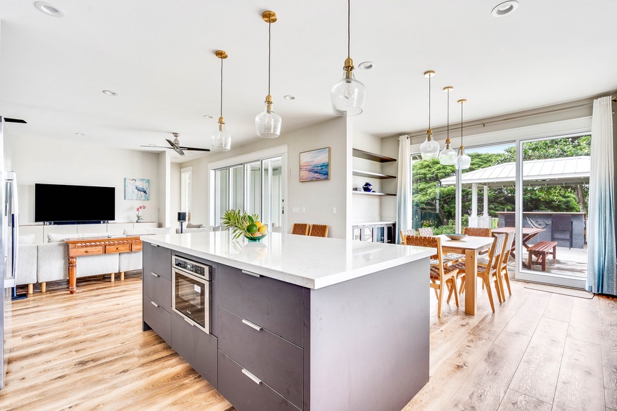 Sleek kitchen with island seating flows into the dining area for easy entertaining.