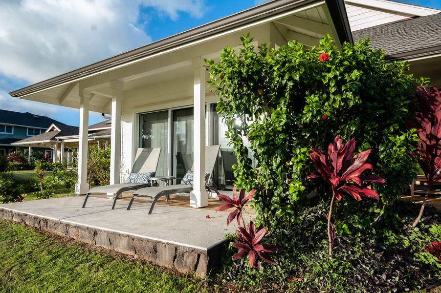 Primary Bedroom Lanai with lounge chairs and golf course and sunset views