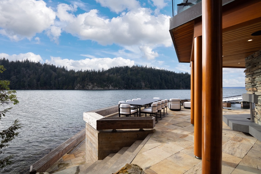 Relax on your private waterfront terrace with stunning lake views and elegant outdoor dining perfectly positioned for memorable meals.