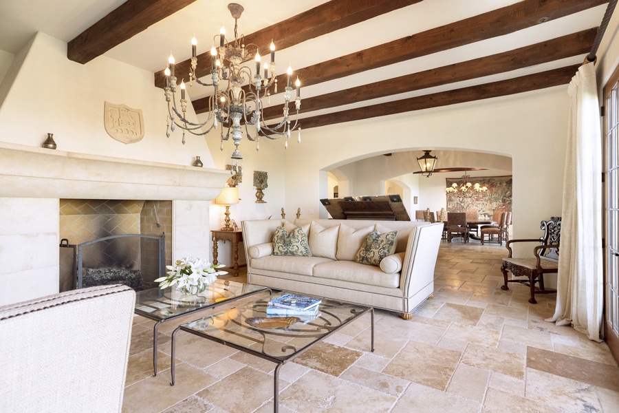 The home's Tuscan-inspired architecture can be felt throughout, with beautiful art and high-end furnishings creating a warm and inviting atmosphere