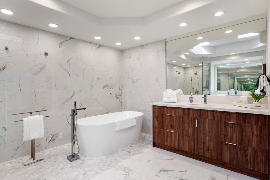 Luxurious spa-like ensuite with a wide vanity space and a soaking tub