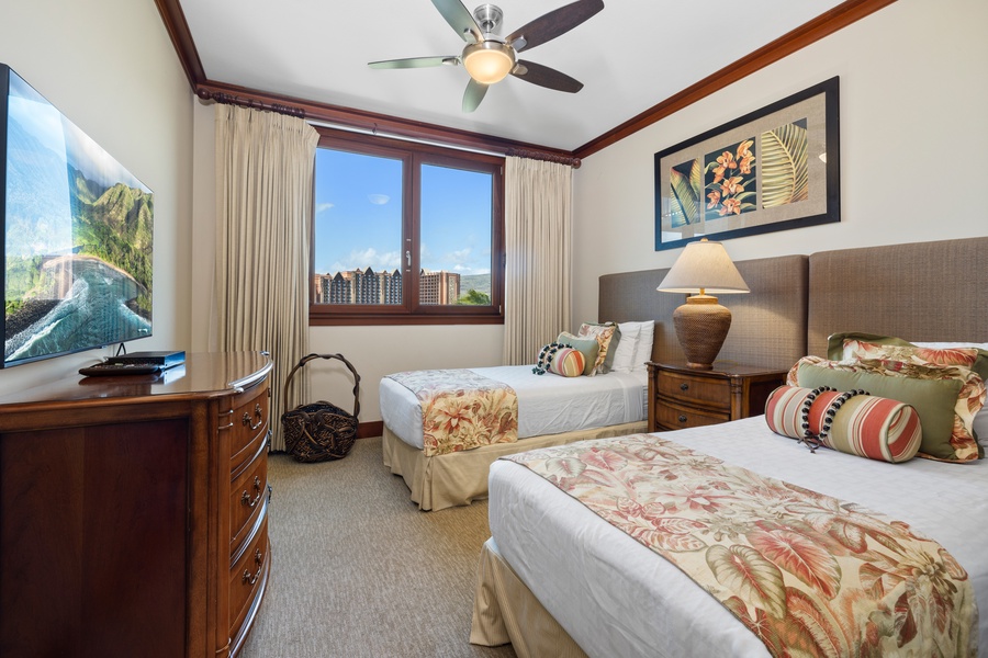 The second guest bedroom has extra long twin beds that can be converted to a king bed.