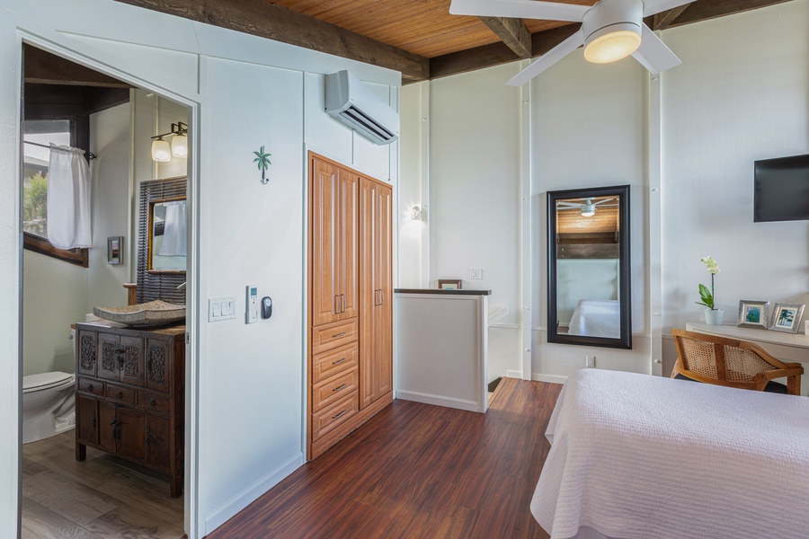 This beautifully appointed king suite includes an ensuite bath, wardrobe storage, and easy access to indoor and outdoor spaces—perfect for couples or parents.