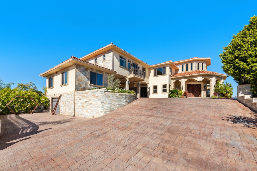 Every detail of the approach hints at the elegance waiting beyond the front door.