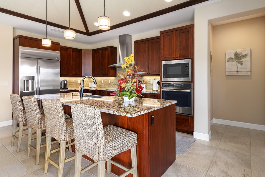 Kitchen in dark wood cabinetry.