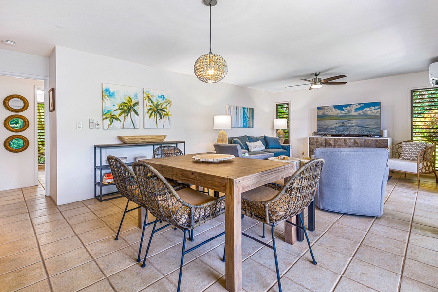 The dining area opens up to the living space, providing a seamless flow for shared meals and relaxation.