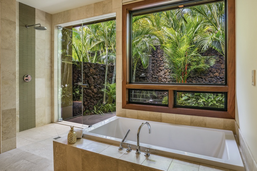 Primary bath’s oversized soaking tub, separate walk-in shower, and outdoor shower garden.