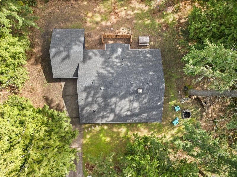 A bird’s-eye view showcases the home’s tranquil setting and spacious outdoor layout.