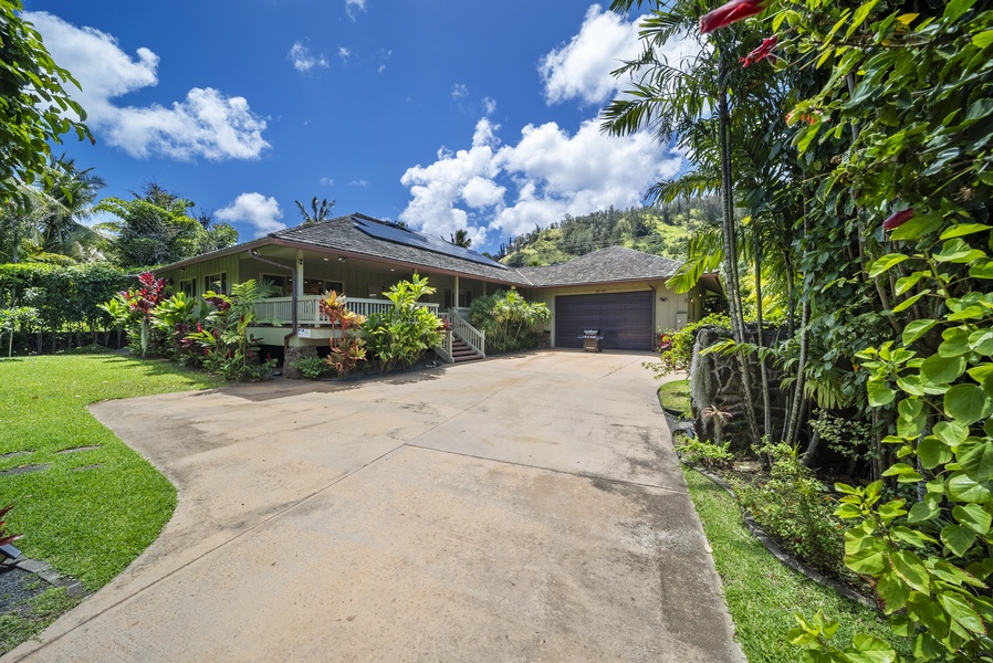 Driveway entry with ample parking—secure within a gated North Shore community.