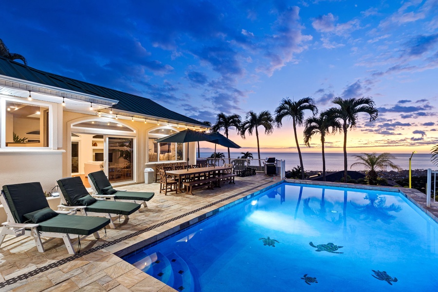 Luxurious villa features private pool and tropical paradise setting with stunning ocean views at sunset.