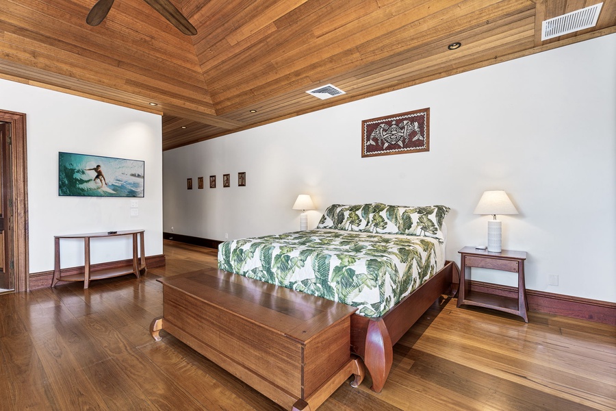 Drift off to sleep surrounded by rich tropical wood and authentic island art, where comfort meets the natural beauty of your island retreat.