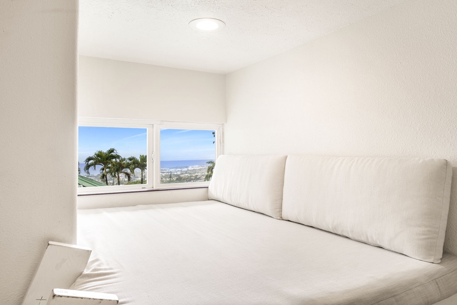 Cozy reading and lounging nook in the keiki room