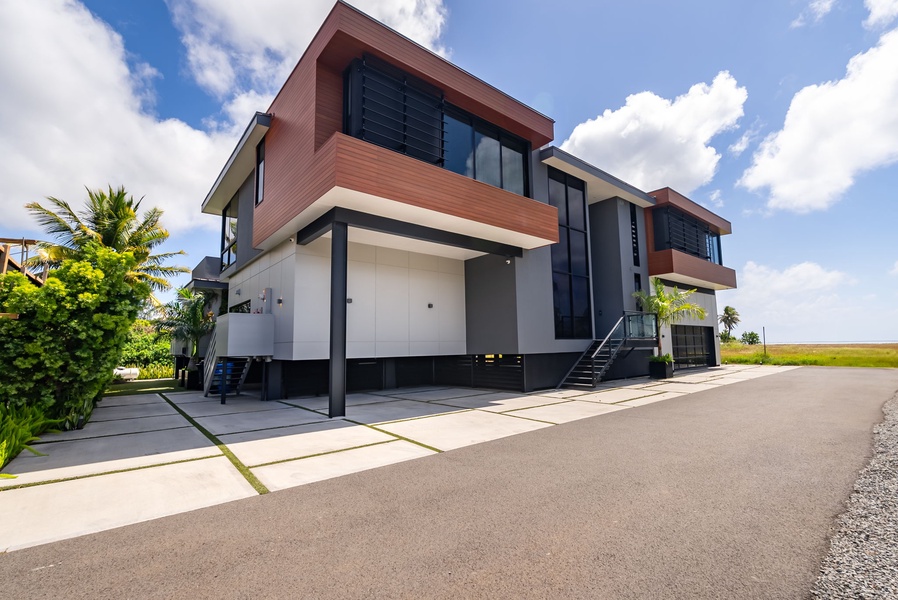 The villa’s clean lines and striking façade make every return feel like arriving at a private resort.