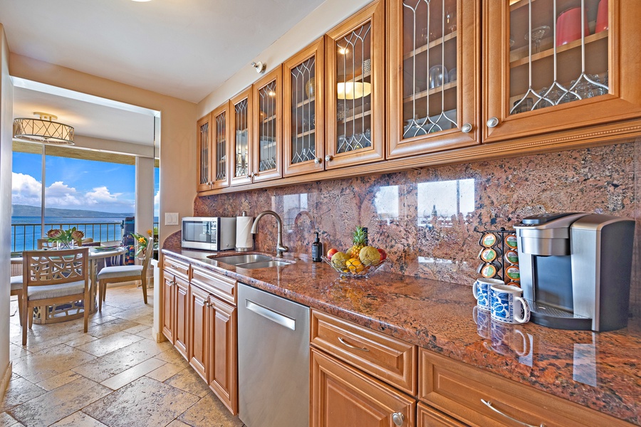 Royal Kahana 610's fully equipped kitchen features granite countertops and plenty of cabinet space, perfect for preparing meals.
