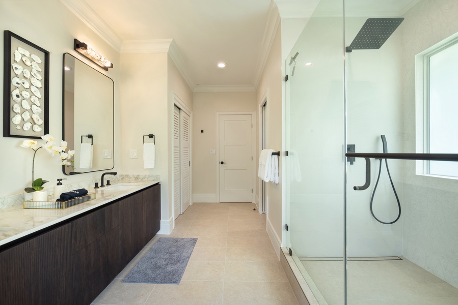 Modern bathroom with a walk-in shower and sleek fixtures.