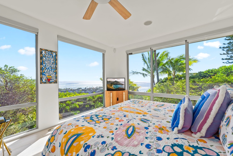 Relax and recharge with peaceful views of palms and ocean blues.