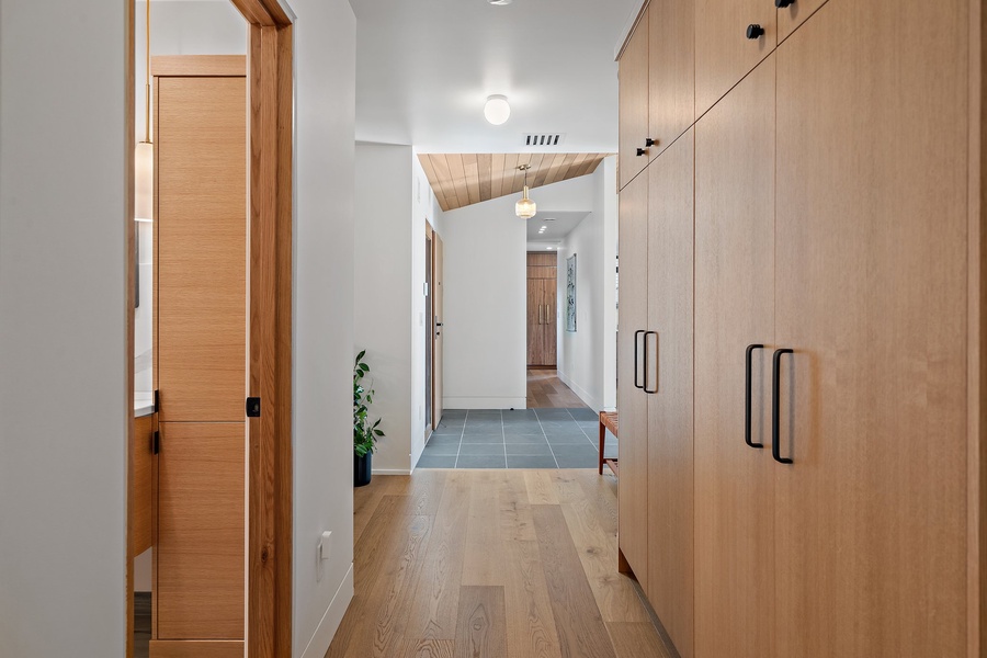 The hallway with plenty of storage options.