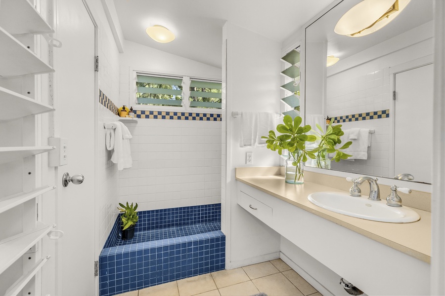Primary bathroom ensuite with fun tiled shower stall